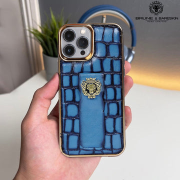 Sky Blue Leather Mobile Cover Golden Rim Finger Strap Cum Stand iPhone Series Deep Cut Croco Textured With Golden Lion Logo By Brune & Bareskin