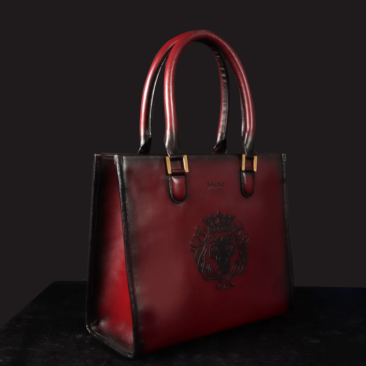 Wine Leather Medium Sized Hand-Bag with Embossed Lion