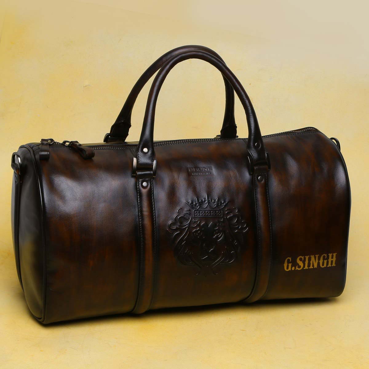 Customized Embossed Lion Logo with G Singh Initial on Brown Duffle  Bag by Brune & Bareskin