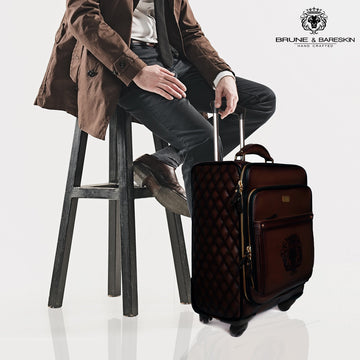 Dark Brown Leather Diamond Stitched Quad Wheel Trolley Bag With Embossed Lion Logo by Brune & Bareskin